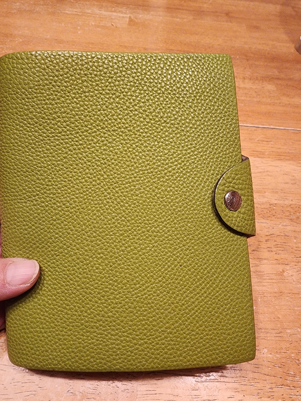 authentic Hermès Ulysse PM notebook cover crafted in green Togo calfskin leather